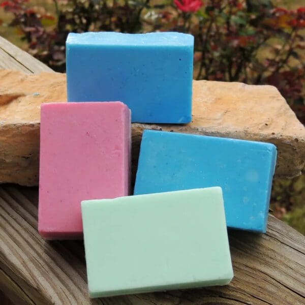 Four bars of soap in different colors.