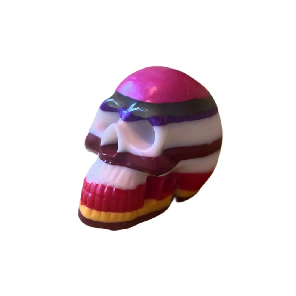 Multicolored striped skull figurine.