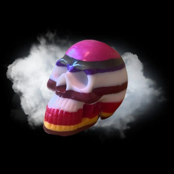 Multicolored striped skull with white background.