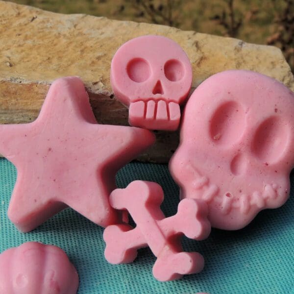 Pink skull, star, and bone shaped soaps.