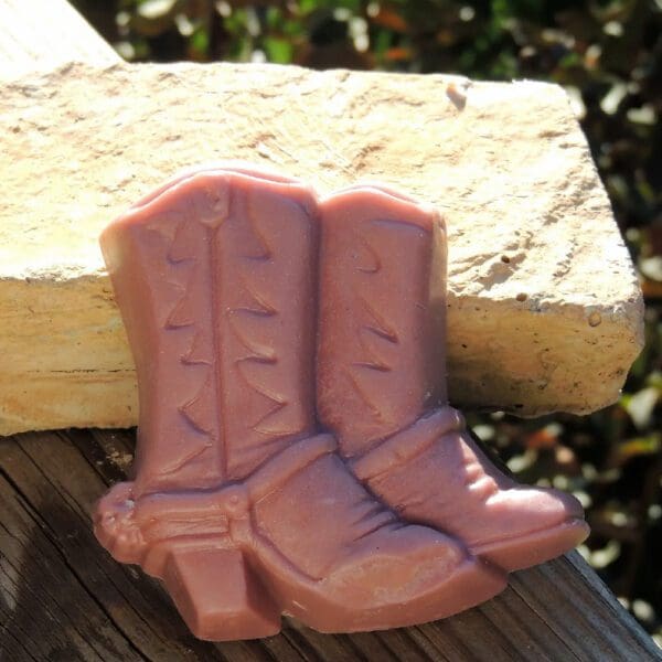 Pair of pink cowboy boot soaps.