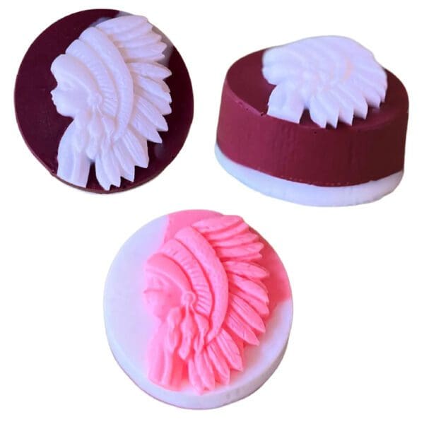 Three round soaps with Native American headdresses.