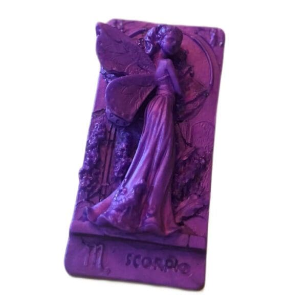 Purple fairy figurine of Scorpio zodiac sign.