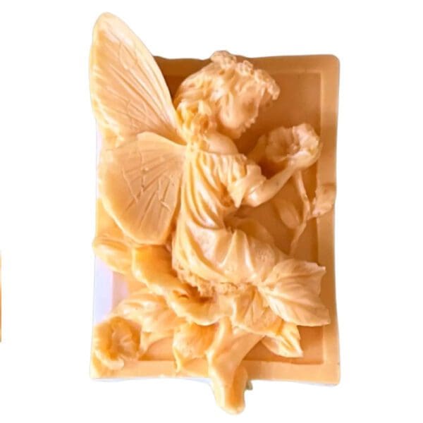 A carved soap sculpture of a fairy.