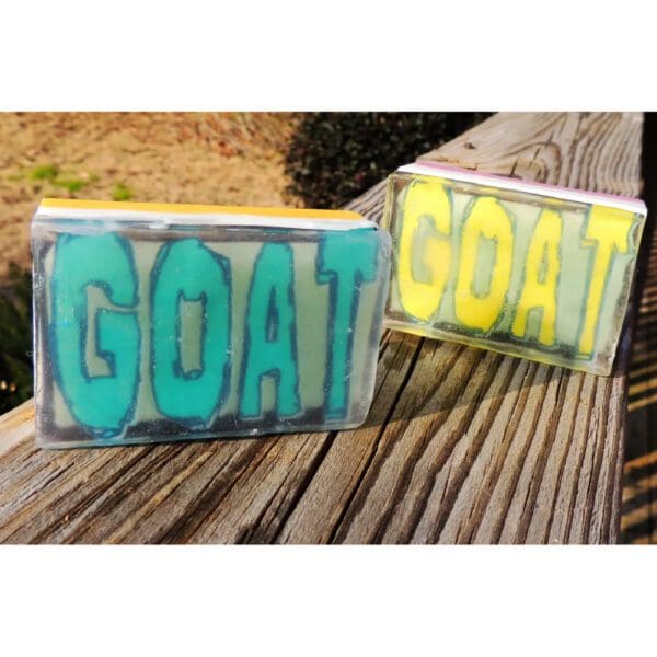 Two soap bars with the word "GOAT" on them.