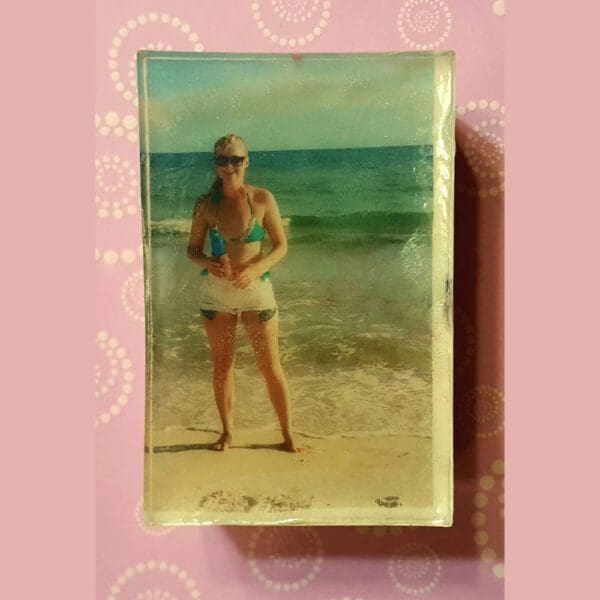 Woman in swimsuit on a beach.