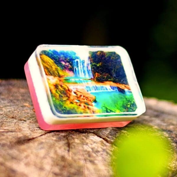 Waterfall soap with green and blue scene.