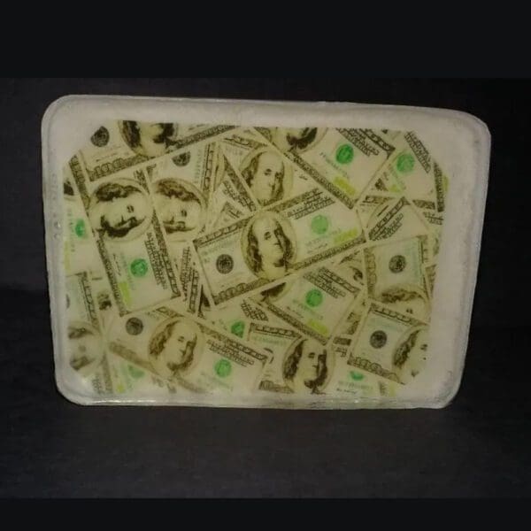 White tray with a hundred dollar bill design.