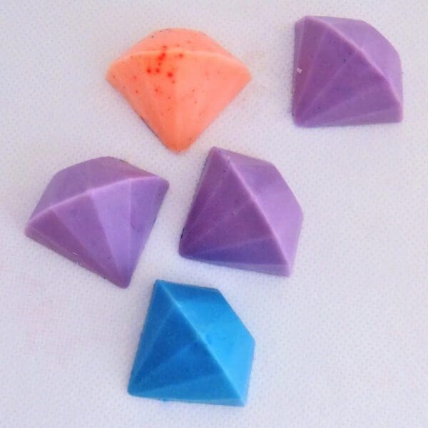 Five diamond-shaped chocolate candies.