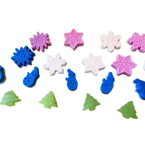 Assorted colorful winter-themed soap charms.