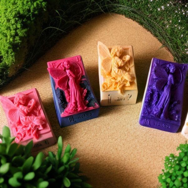 Four colorful zodiac soap bars with fairies.