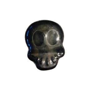 Black skull-shaped resin object.